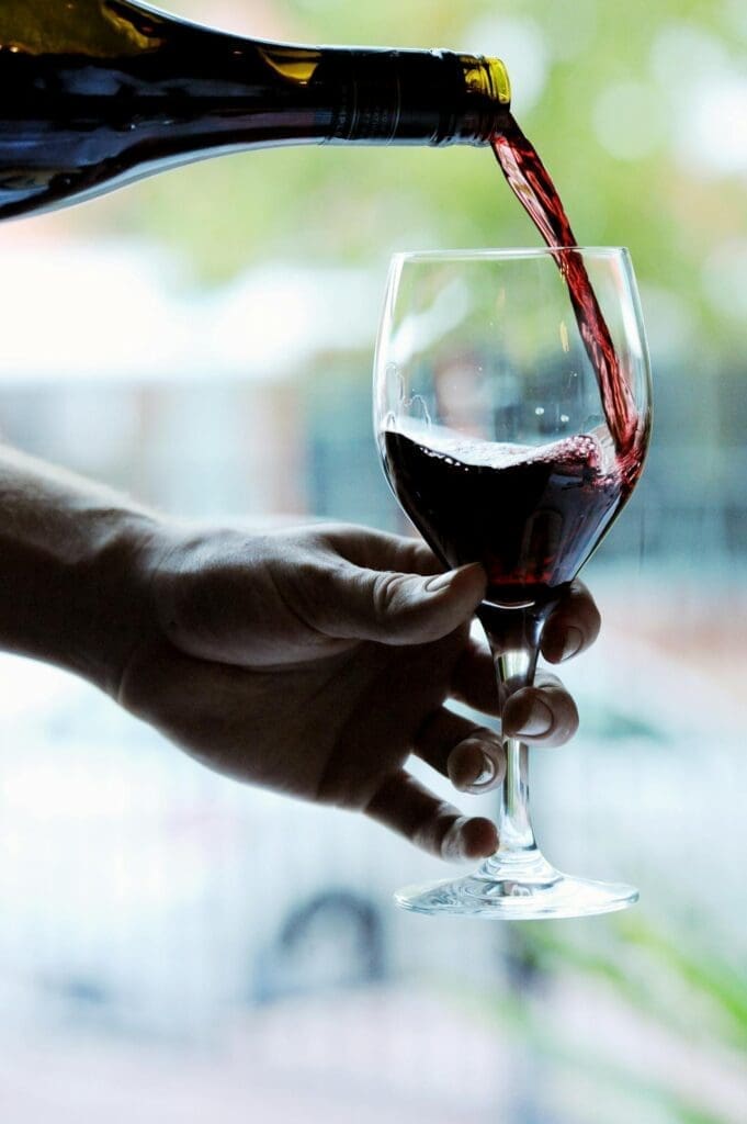 Wine being poured during outdoor dining Reno guests enjoy for a romantic spring patio dinner.